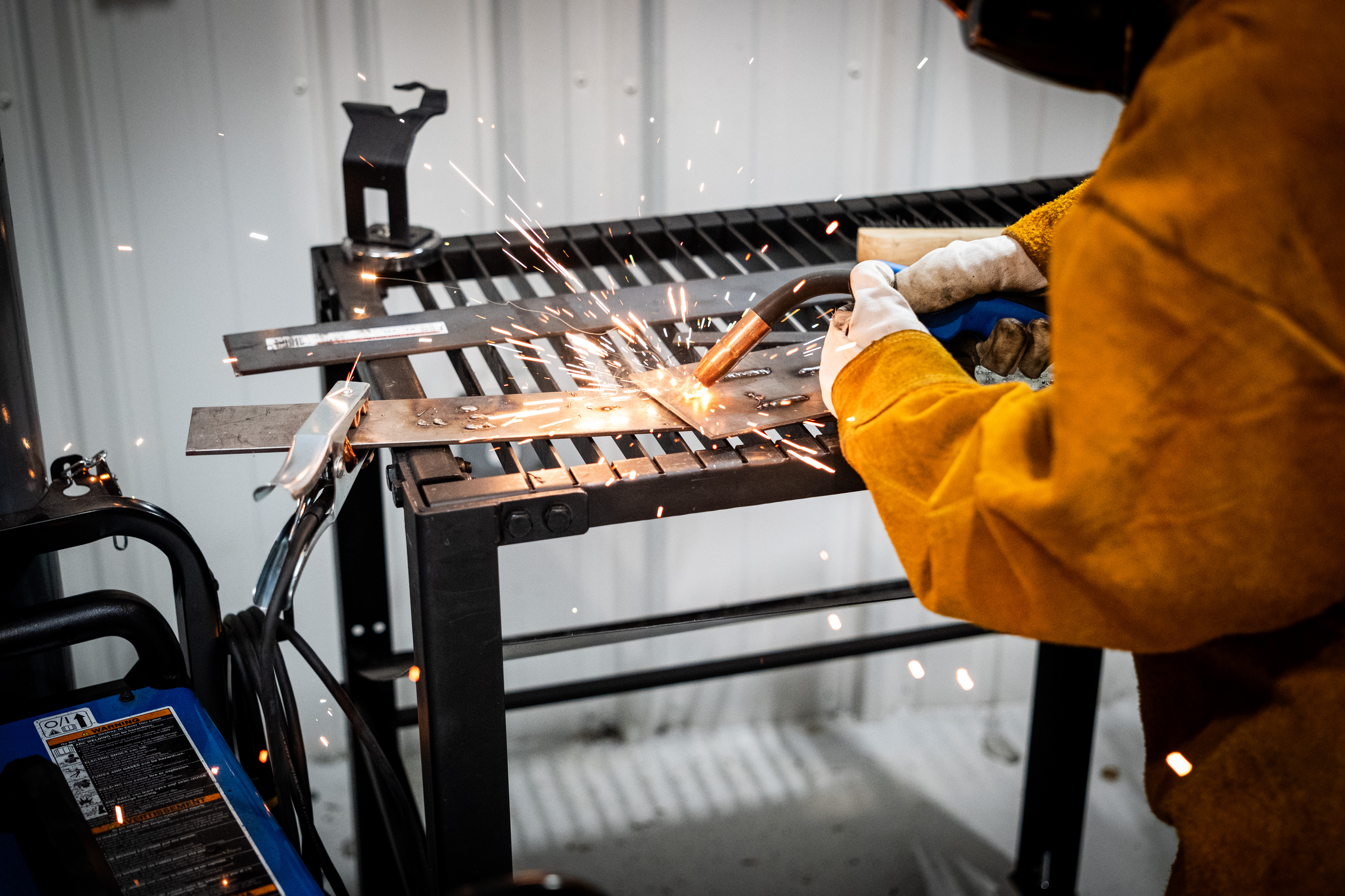 Workforce trainee practicing technical skills in a workshop setting